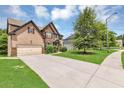 Charming two-story home with a well-manicured lawn and a two-car garage, enhancing curb appeal at 2619 Dayview Ln, Atlanta, GA 30331