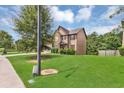 View of a home surrounded by lush greenery and well-maintained lawn, creating a serene setting at 2619 Dayview Ln, Atlanta, GA 30331