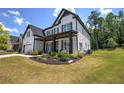 Beautiful two-story home with a well-manicured lawn and welcoming front porch at 841 Keystone Dr, Woodstock, GA 30188