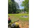 Spacious backyard offers plenty of green space and outdoor activities at 616 Burnt Creek Nw Way, Lilburn, GA 30047