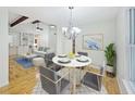 Dining area boasts modern chandelier, seating for four, and natural light at 6800 Brookwood Ct, Douglasville, GA 30135