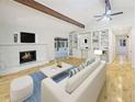 Bright living room features a fireplace, hardwood floors, and custom built-ins at 6800 Brookwood Ct, Douglasville, GA 30135