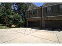 Two-story home featuring a two-car garage and traditional architecture, with a large driveway at 4746 Highland Ave, Sugar Hill, GA 30518