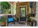 Cozy front porch with seating and decorative plants for a relaxing entrance at 4746 Highland Ave, Sugar Hill, GA 30518