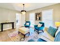 Comfortable living area featuring hardwood floors, recessed lighting, and stylish, modern furnishings at 430 Thornbush Trce, Lawrenceville, GA 30046