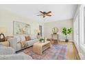 Sunlit living room showcasing hardwood floors, stylish decor, and large windows at 2463 Briarmoor Ne Rd, Atlanta, GA 30345