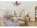Bright living room with hardwood floors, modern furnishings, and a ceiling fan at 2463 Briarmoor Ne Rd, Atlanta, GA 30345