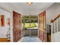 Inviting entryway with large double doors offering views of the front yard and access to the home's interior at 4389 Hambrick Way, Stone Mountain, GA 30083