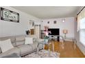 Bright living room featuring hardwood floors, neutral decor, and an abundance of natural light at 4389 Hambrick Way, Stone Mountain, GA 30083