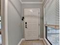Welcoming entryway with neutral paint, tile flooring, and a window for natural light at 1010 Donegal Se, Smyrna, GA 30080