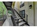 Exterior view of the building with stairs and railings, providing access to units at 1010 Donegal Se, Smyrna, GA 30080