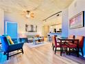 Bright living room with hardwood floors, floor to ceiling windows, and an open floor plan at 400 W Peachtree Nw St # 2704, Atlanta, GA 30308