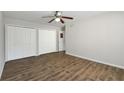 Bedroom features hardwood floor, ceiling fan and double closets at 2825 Northeast Ne Expy # F003, Atlanta, GA 30345