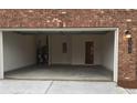 A spacious two car garage featuring ample room for storage at 1392 Weatherbrook Cir, Lawrenceville, GA 30043