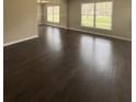 Spacious living room featuring gleaming hardwood floors and large windows that flood the space with natural light at 2830 Norgate Ln, Decatur, GA 30034