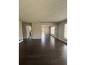 Inviting living area featuring hardwood floors, neutral walls, and ample space for versatile arrangements at 2830 Norgate Ln, Decatur, GA 30034