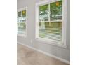 Bright bedroom featuring sunlit windows with blinds and neutral wall paint at 772 Aerial Se Way, Atlanta, GA 30312