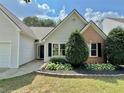 Well-maintained home with beautiful landscaping, fresh green lawn, and a welcoming entrance at 3050 Baymount Dr, Lawrenceville, GA 30043