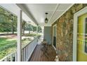 Inviting covered front porch with stone accents and outdoor seating, perfect for relaxing at 180 Kim Trail Trl, Stockbridge, GA 30281