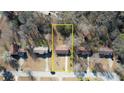 Aerial view of property highlighting lot lines in suburban neighborhood at 11 Grove Ln, Hampton, GA 30228