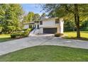 Attractive property featuring a spacious driveway and lush lawn, enhancing its appeal at 2010 Barnes Mill Rd, Marietta, GA 30062