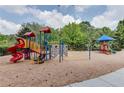 Neighborhood playground with slides, climbing areas, and a soft, safe ground covering at 7204 Eton Ln, Locust Grove, GA 30248