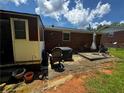 Backyard patio with weathered concrete and outdoor seating, perfect for relaxing in the backyard at 2933 Arlington Rd, East Point, GA 30344