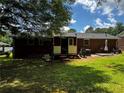Grassy backyard with a patio, providing an outdoor area for entertaining and leisure activities at 2933 Arlington Rd, East Point, GA 30344