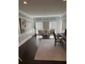 Well-lit home office with neutral wainscoting, modern lighting, and stylish furniture at 3201 Palisades Se Ct, Marietta, GA 30067