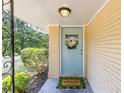 Inviting front entrance featuring a charming door with a wreath and a decorative 'Hello' welcome mat at 3205 Mcafee Rd, Decatur, GA 30032