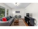 Cozy living room with large windows, hardwood floors, comfortable seating, and stylish decor at 3205 Mcafee Rd, Decatur, GA 30032