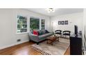 Bright living room features ample natural light, neutral color palette, and comfortable furnishings at 3205 Mcafee Rd, Decatur, GA 30032