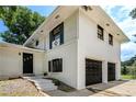 Charming two-story home with painted brick, black window frames and a two-car garage at 1894 Twin Falls Rd, Decatur, GA 30032