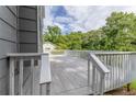 Elevated deck with white railing overlooking the yard and offering an outdoor space for relaxation at 4856 Habersham Sw Rdg, Lilburn, GA 30047