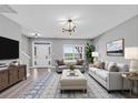 Cozy living room featuring stylish furniture, neutral colors, and ample natural light at 5195 Oaks Landing Ct, Sugar Hill, GA 30518