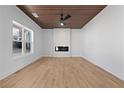 Bright living room featuring a modern fireplace, stylish ceiling, and luxury vinyl plank flooring at 1337 Fairfield Dr, Lilburn, GA 30047