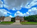Charming two-story brick home with a well-manicured lawn and a two-car garage at 171 Shaker Hollow Drive Dr, Mcdonough, GA 30253