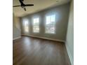Spacious living room is filled with natural light and has beautiful hardwood floors at 970 Bibbs Circle Nw # 12, Atlanta, GA 30318