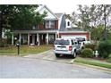 Beautiful two-story brick home featuring an attached garage, well-kept lawn, and mature landscaping at 3824 Smith Creek Ct, Buford, GA 30519