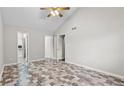 A spacious bedroom with vinyl flooring, ceiling fan, and a walk-in closet, offering comfort and storage at 536 Cherokee Overlook Court Ct, Canton, GA 30115