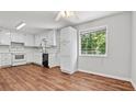 Bright kitchen featuring white cabinets, updated appliances, and hardwood flooring, providing a modern space at 536 Cherokee Overlook Court Ct, Canton, GA 30115