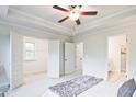 Bright main bedroom with coffered ceilings, an en suite bath and a walk-in closet at 541 Fundao Ln, Lawrenceville, GA 30046