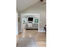 Bright living room featuring light wood floors and a view into the living area at 6878 Vic Ar Rd, Atlanta, GA 30360
