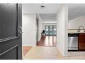 Inviting condo foyer leading to a bright living space with stainless steel appliances at 3650 Ashford Dunwoody Ne Rd # 413, Atlanta, GA 30319