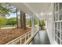 View from front porch features a meticulously maintained landscape with mature trees and shrubs at 2694 Hickory Valley Dr, Snellville, GA 30078