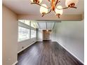 Open living room with vaulted ceilings and modern lighting fixtures at 4342 Riverwood Cir, Decatur, GA 30035