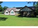 Beautiful two-story home with a manicured lawn, complemented by a sturdy metal roof for added value at 5225 Kings Hwy, Douglasville, GA 30135