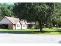 Attractive home with a neat lawn, carport, and a reliable metal roof ensures comfort and protection at 5225 Kings Hwy, Douglasville, GA 30135