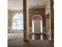 Spacious living room with hardwood floors and views into the dining room at 5035 Harbor Ridge Dr, Buford, GA 30518