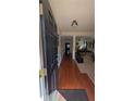 Spacious foyer with hardwood floors, leading into an open-concept living and dining area at 2435 Hickory Station Cir, Snellville, GA 30078